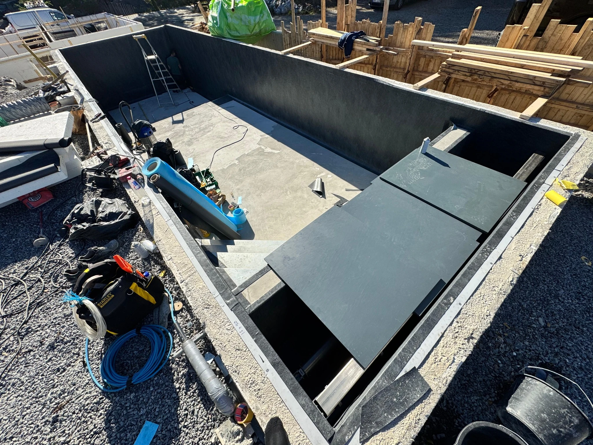 The next construction stage with the pool shell prepared and the first lining insulation being fitted